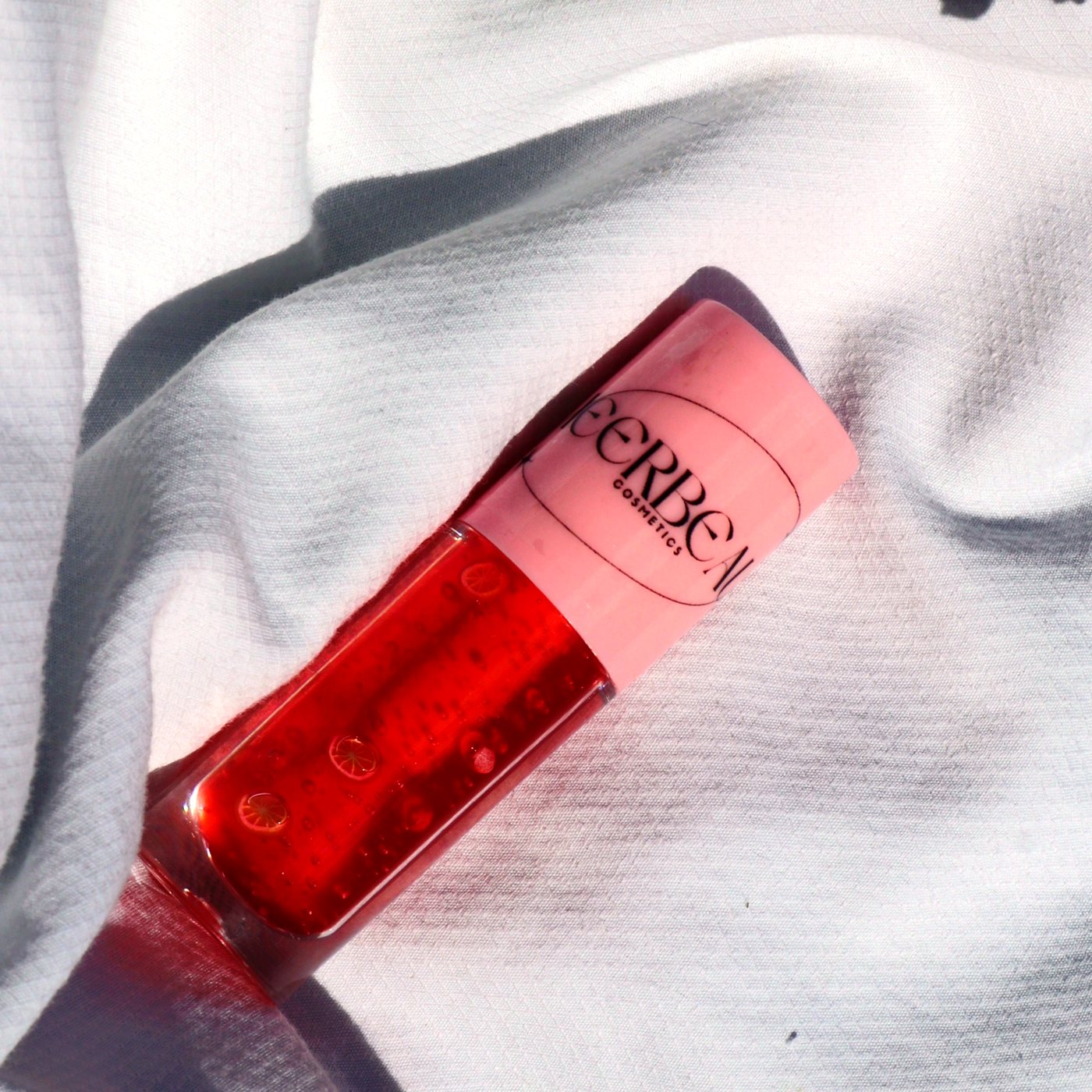 Orange Peach, high shine tinting jelly gloss, in a pink-capped MEERBEAUT wand tube