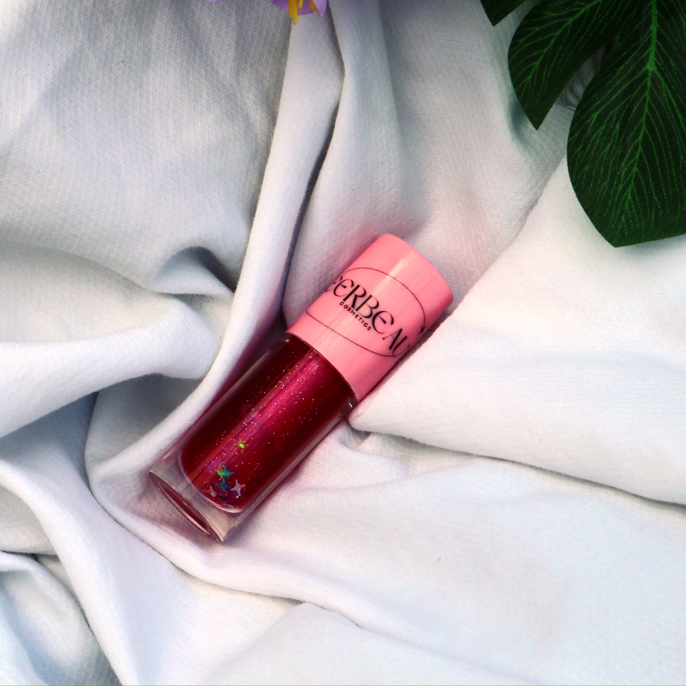 Starlight, high shine glitter gloss, in a pink-capped MEERBEAUT wand tube